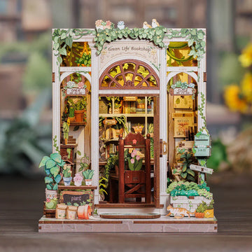 DIY Book Nook Kit assembly with miniature bookshelf, puzzles, and tiny library decor