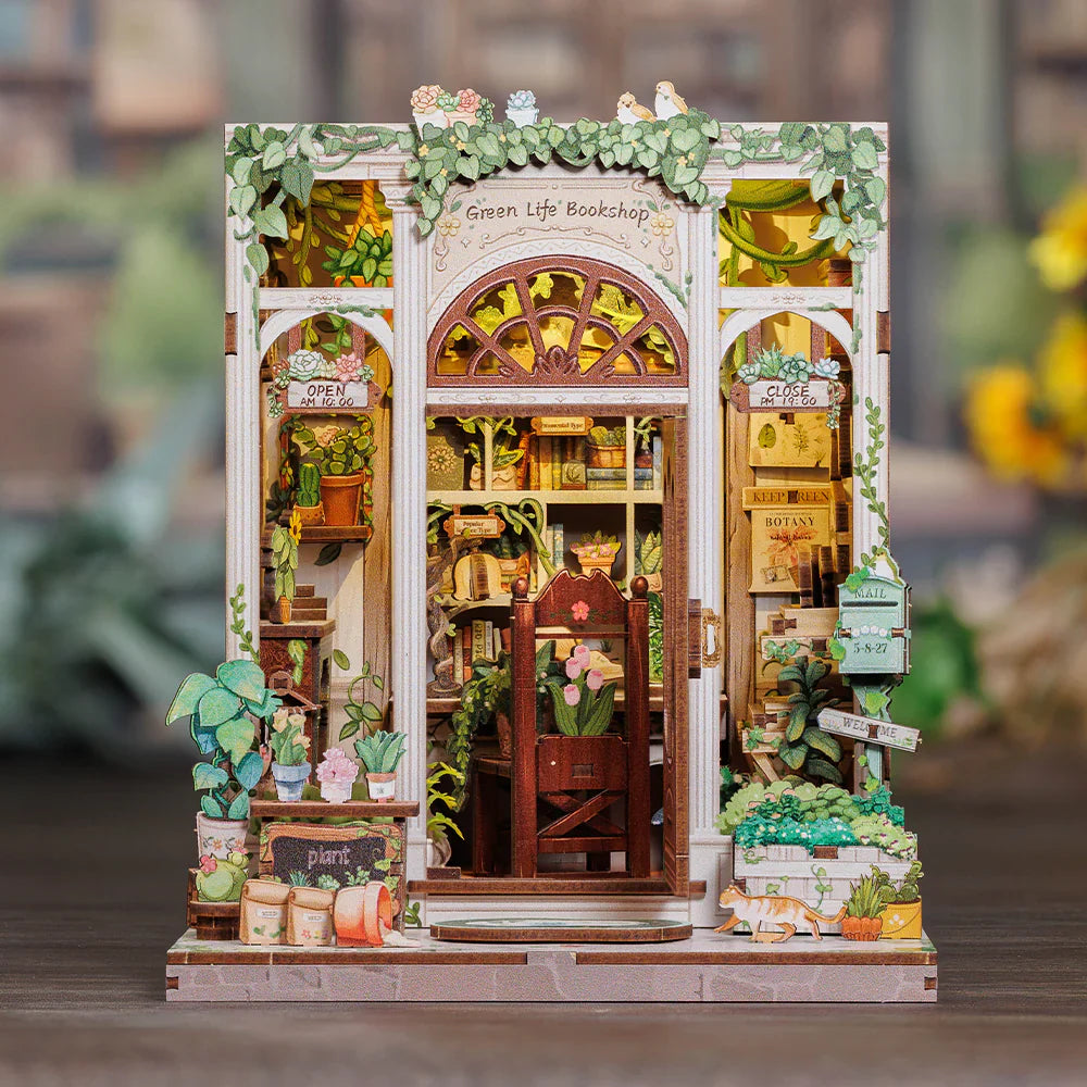 DIY Book Nook Kit assembly with miniature bookshelf, puzzles, and tiny library decor